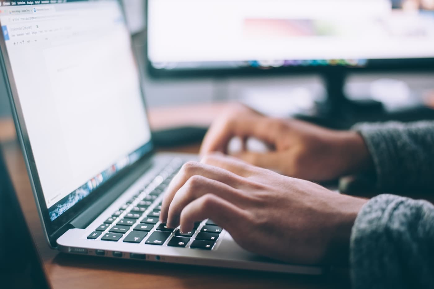 Analyst working alone at a laptop in a bright office